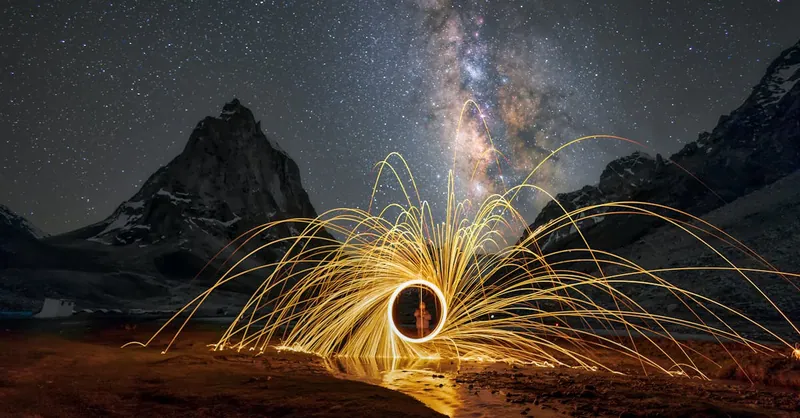Spectacular long exposure of the Milky Way in Leh with light painting, creating a mesmerizing landscape.