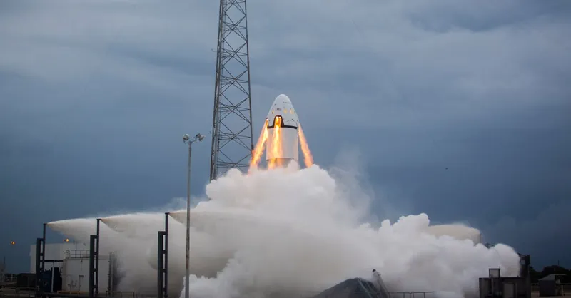 A dramatic rocket launch emitting flames and smoke against a cloudy evening sky, showcasing modern aerospace technology.