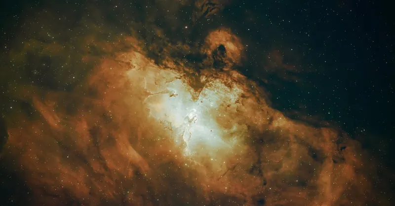 Stunning capture of an emission nebula with vivid colors and cosmic dust.