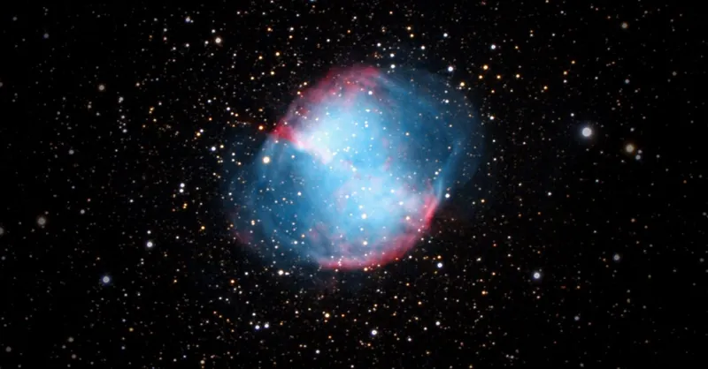 Captivating image of the Dumbbell Nebula (M27) among a myriad of stars in deep space.