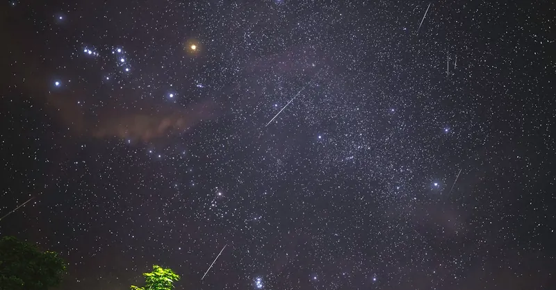 Captivating view of a meteor shower with bright stars over Malita, Philippines, highlighting the night sky beauty.