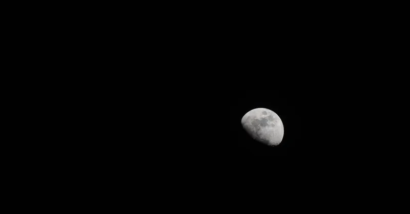 Capture of the moon in the night sky, showcasing craters and detail.