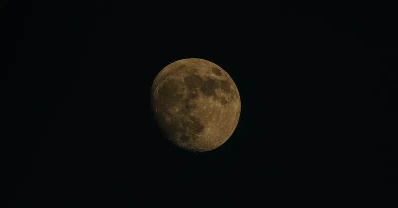 A detailed capture of the moon against a stark black sky, showcasing lunar features.