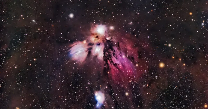 A vibrant star field with a colorful nebula captured in space