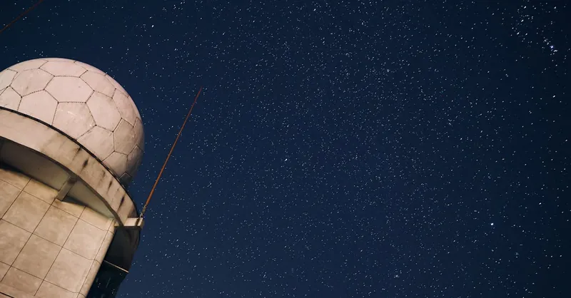 A stunning view of a starry night sky above an observatory dome, capturing the beauty of the cosmos.