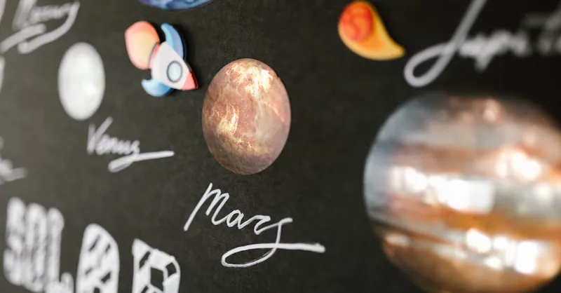 Creative depiction of the solar system planets for school project on a dark background.