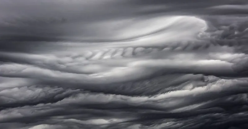 A mesmerizing view of dark, swirling clouds capturing the essence of a stormy atmosphere.