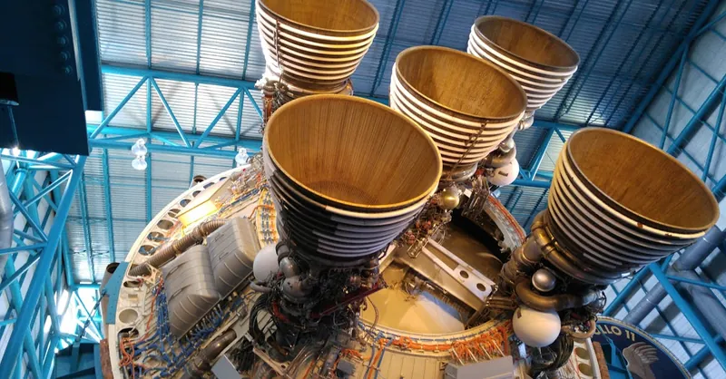 Detailed view of large rocket engines, showcasing intricate engineering and technology at a space museum.