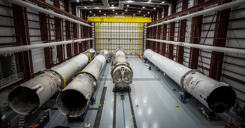 Various huge metal details and fragments of unfinished rocket located in contemporary assembly factory