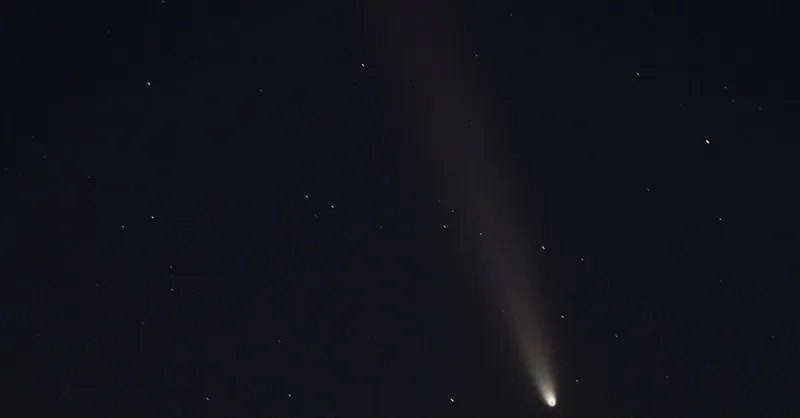 Capture of a comet streaking across a starry night sky in Arizona, United States.