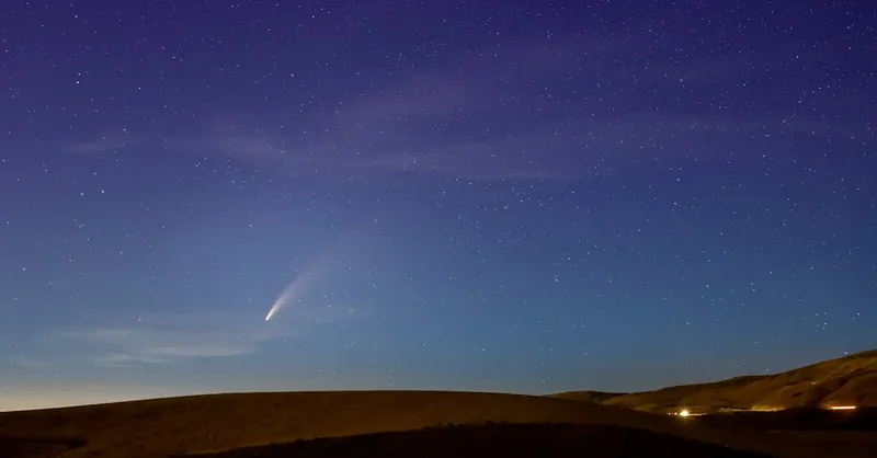 Beautiful night sky with a comet over the hills in Wenatchee, Washington. Perfect astrophotography capture.